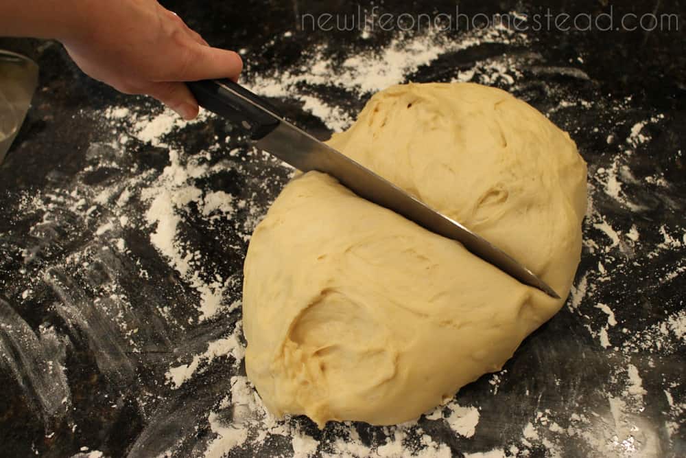 sharp knife to cut dough in half