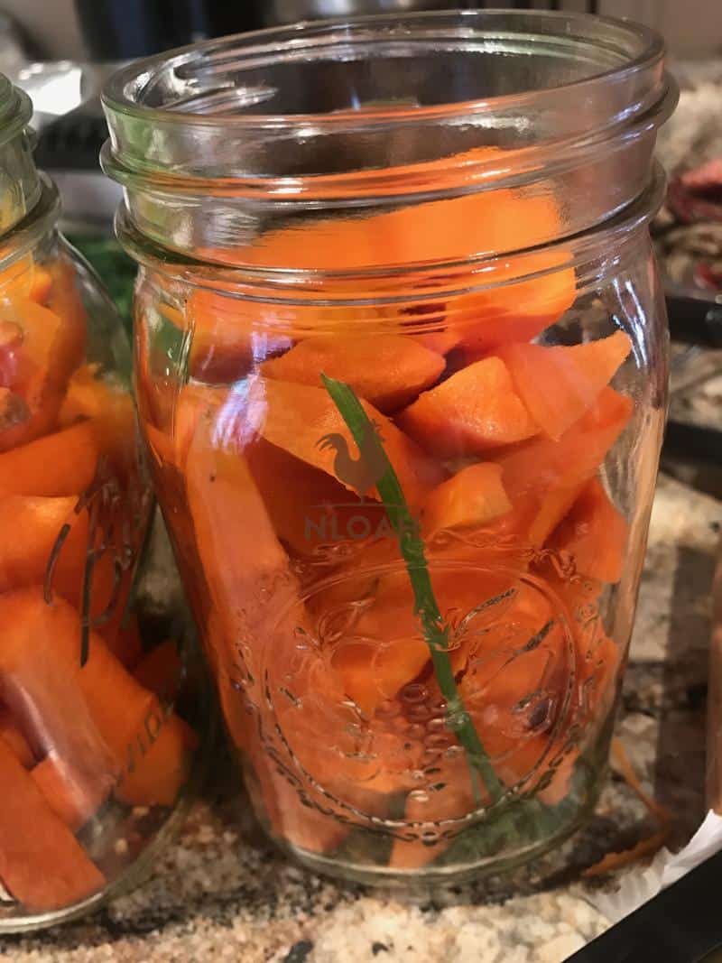 canning jar filled with carrot spears