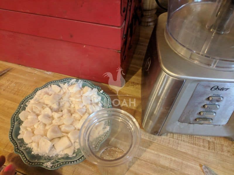 adding chunks of soap to a food processor to make powder