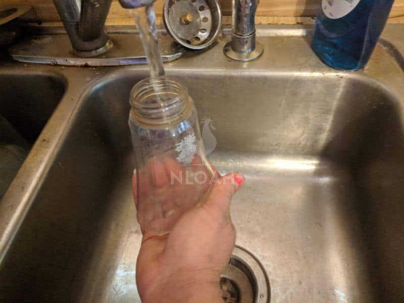 filling soap dispenser with warm water