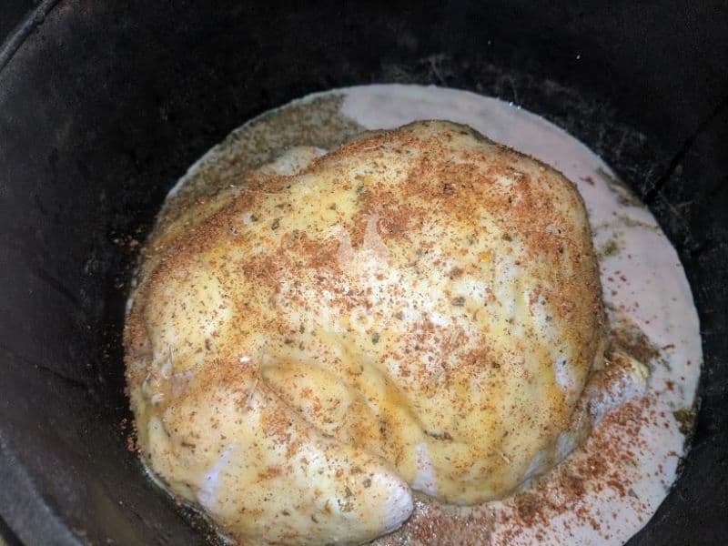 chicken baking in the cook pot