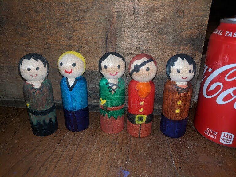 five adorable wooden peg people