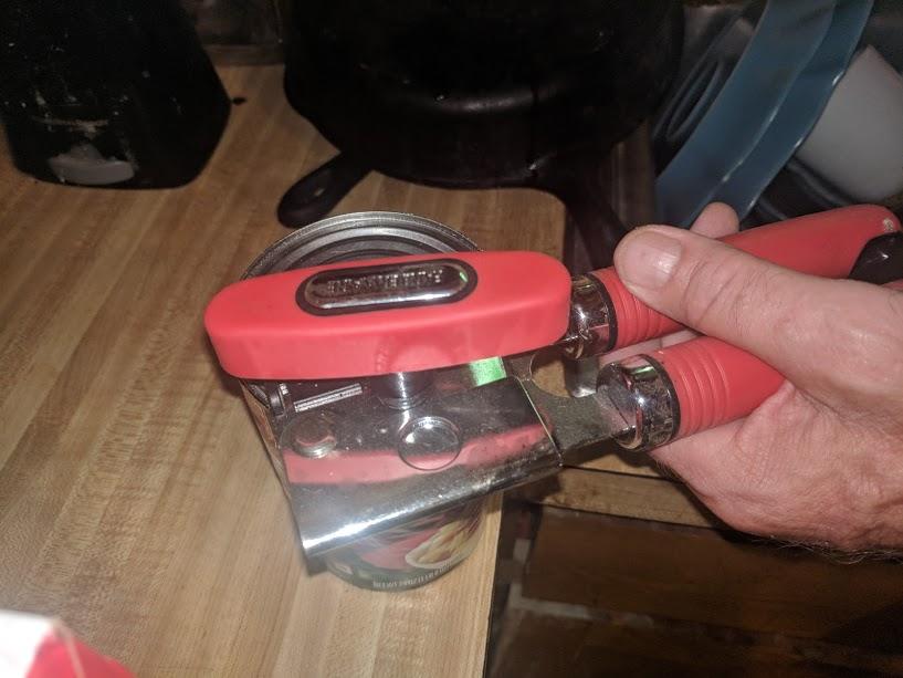removing lid safely with can opener