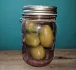 green tomatoes and banana in jar