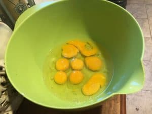 Cracking Eggs into the Mixing Bowl