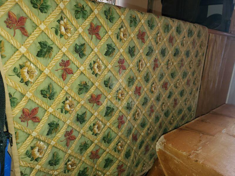 quilt hanging on an indoor clothesline