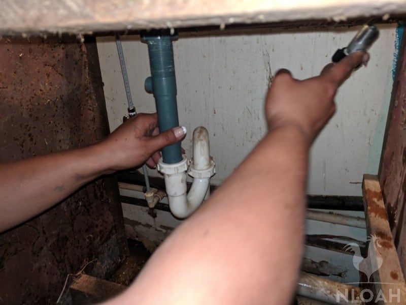 connecting the drain kit to the pipe