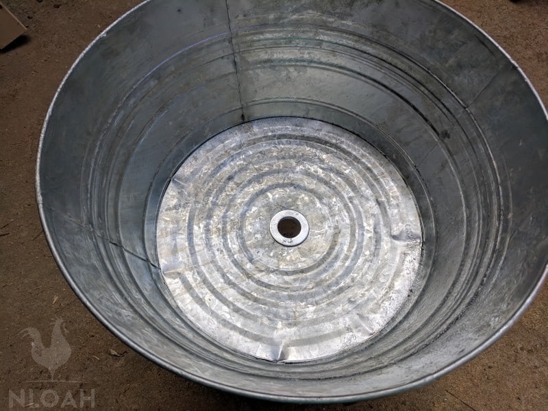 silver ring attached to the galvanized tub