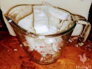 soap base chunk into measuring cup