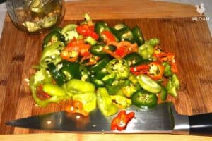 hot peppers on cutting board chopped