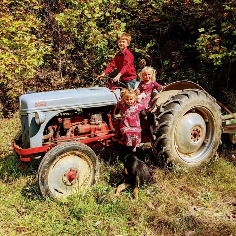 children on small tractor