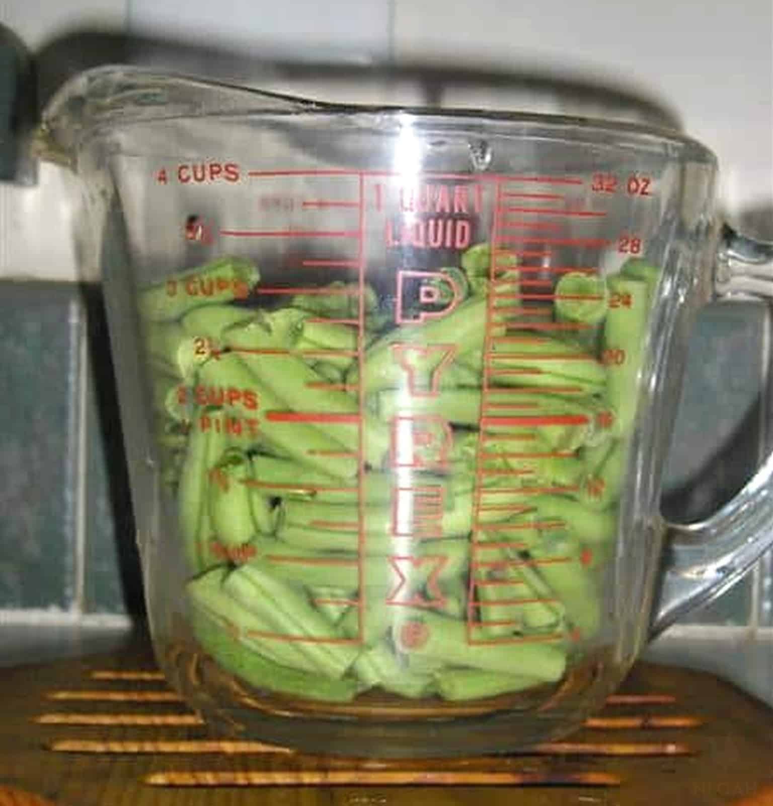 3 cups of green beans in a measuring cup