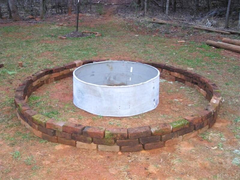 DIY raised bed in progress with 3 layers  of bricks
