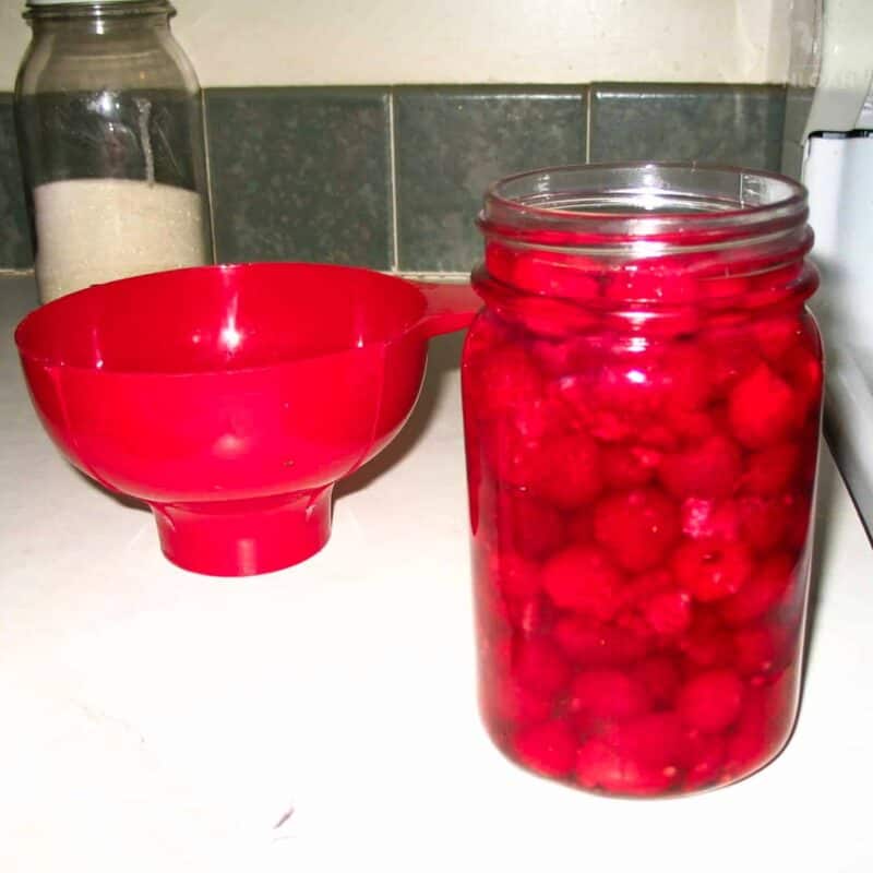 Mason jar filled with raspberries