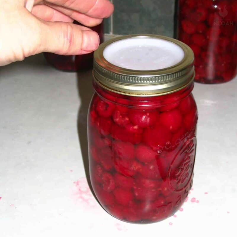 placing lid on jar