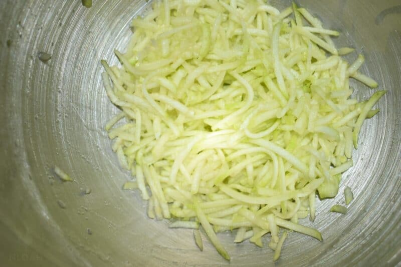 shredded zucchini in pot