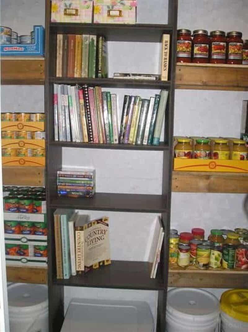 pantry with canned foods buckets and homesteading books