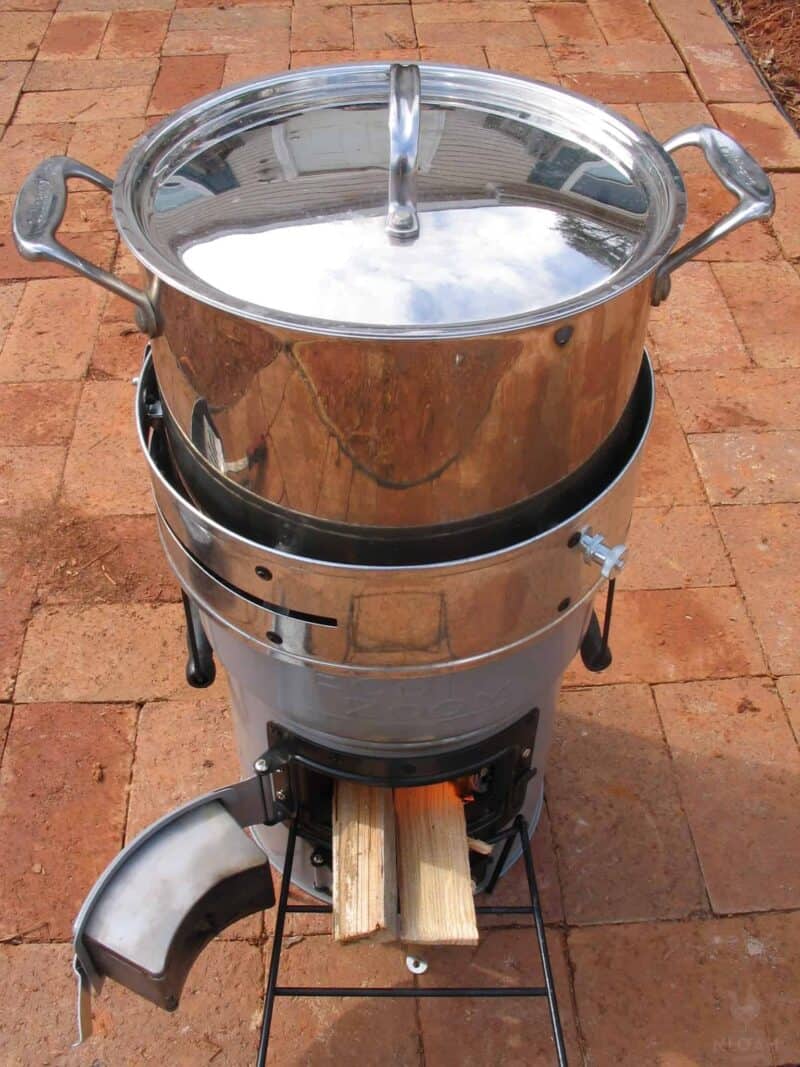 pot of water boiling on a rocket stove