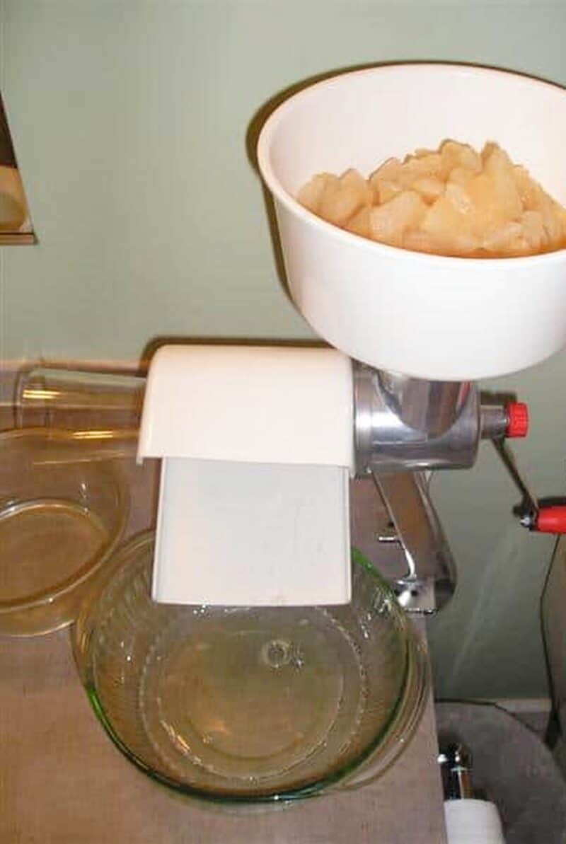 pureeing pears in food strainer