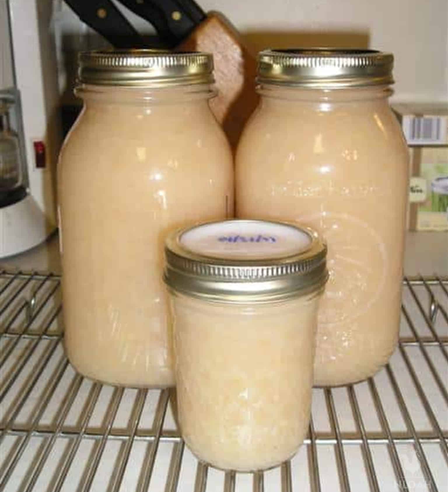 three jars of canned pear sauce