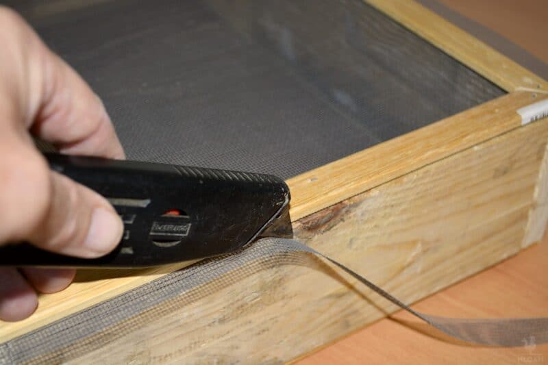 trim the excess netting from the large frame