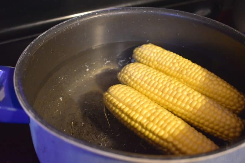 corn in boiling water in pot