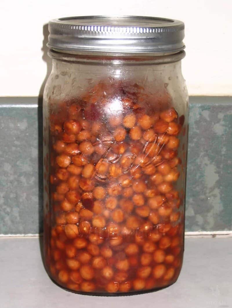 cherry pits inside glass jar