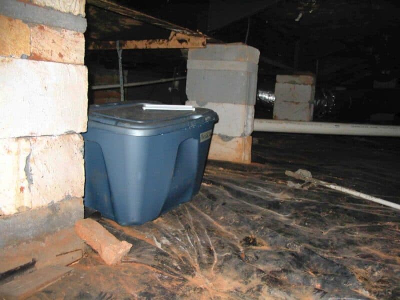 plastic tote box  inside crawl space under the house