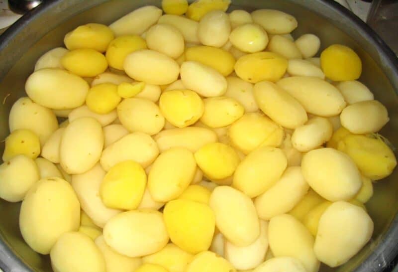 blanched potatoes in pot