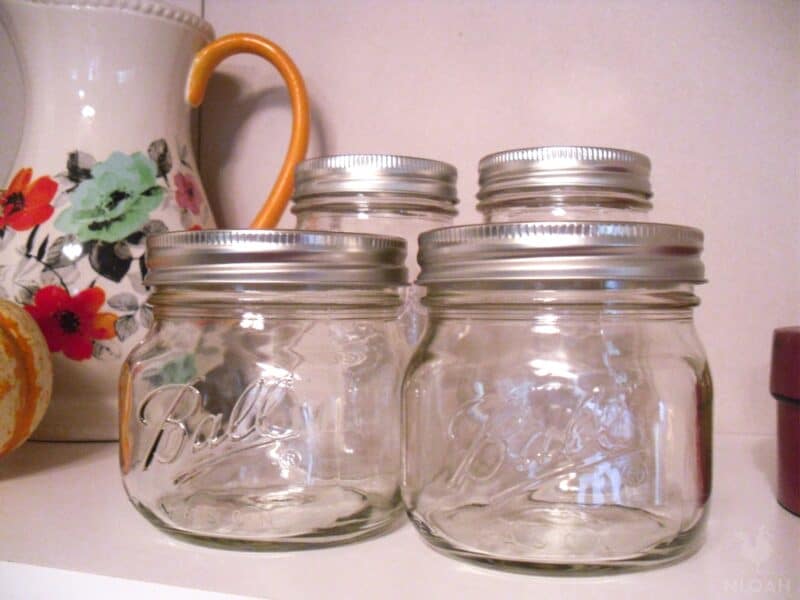 four empty Ball canning jars
