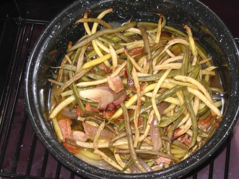 green beans and meat cooking inside pot in Sun Oven