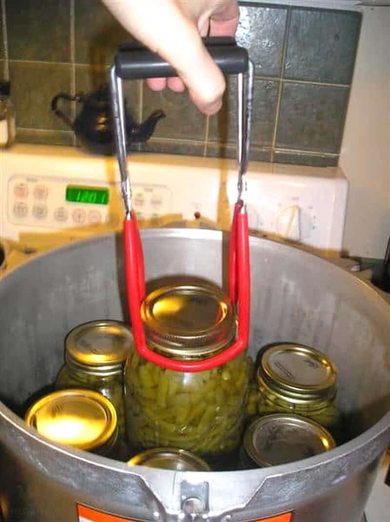 removing jar of green beans with jar lifter