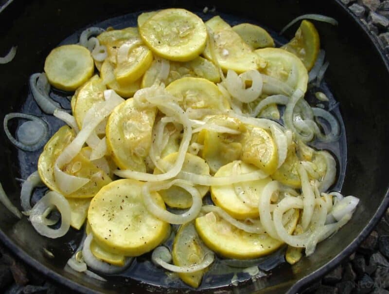 squash and onions in pan