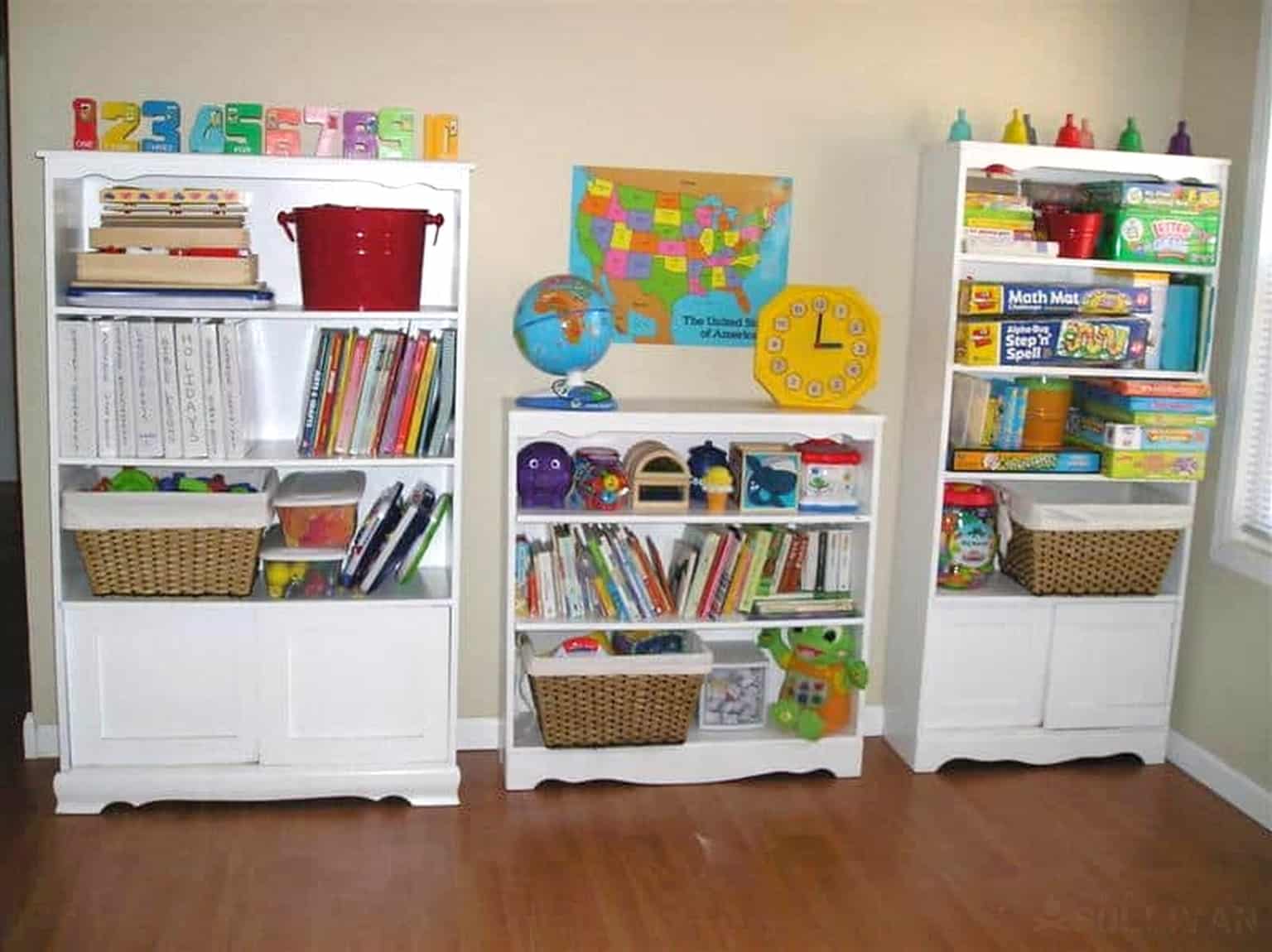 toys and books on bookshelves in homeschooling classroom