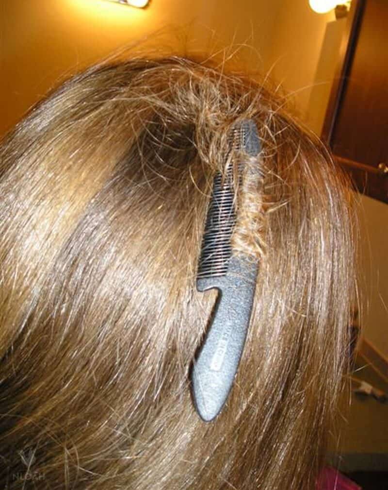 woman with comb stuck in hair