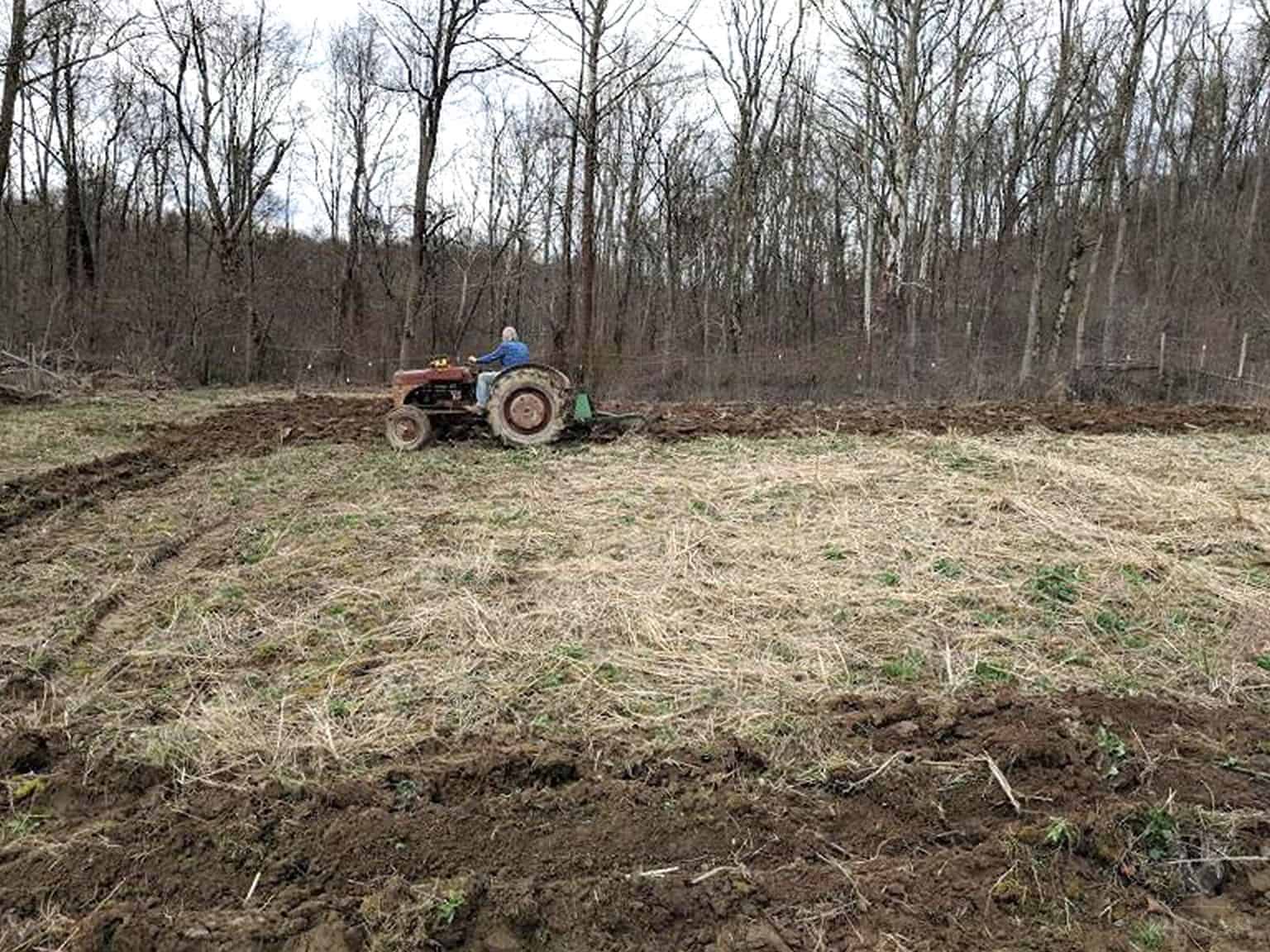 plowing garden lot with tractor