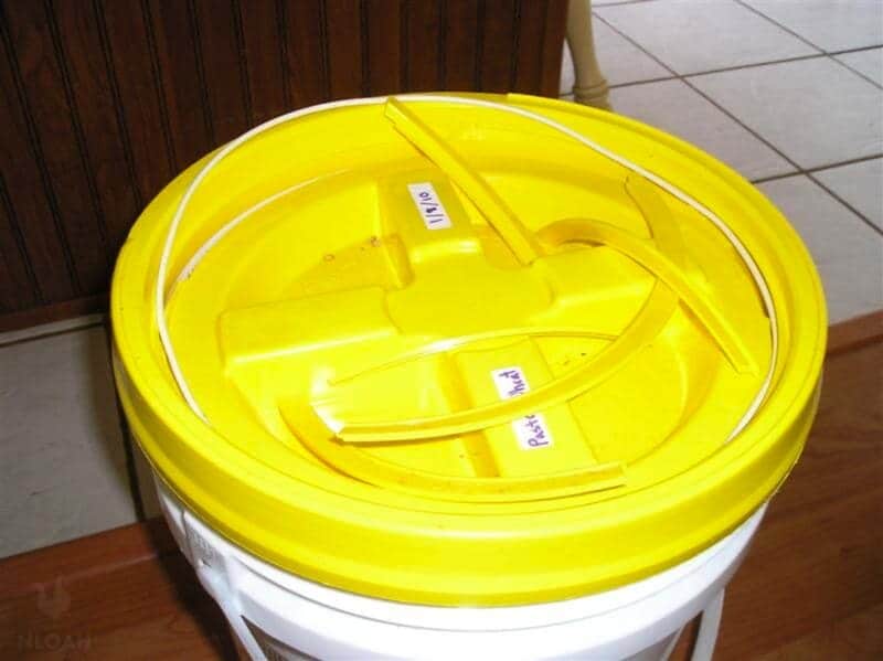 yellow broken bucket lid