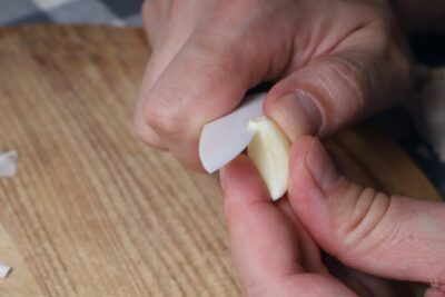 cutting root end from garlic clove