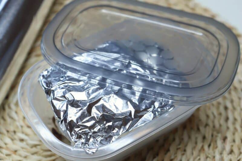 pemmican wrapped in aluminum foil in tupperware