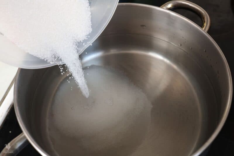 adding sugar to pot