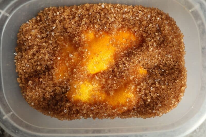 brown sugar with orange peel in container