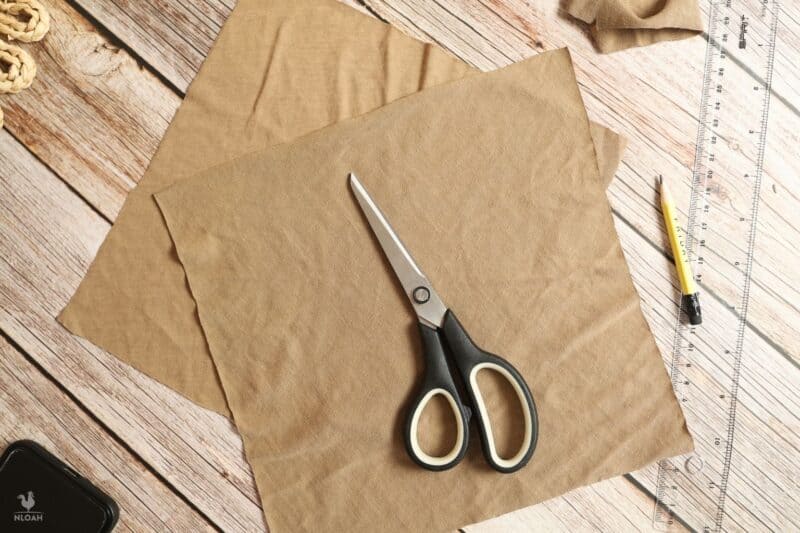 two fabric squares and scissors