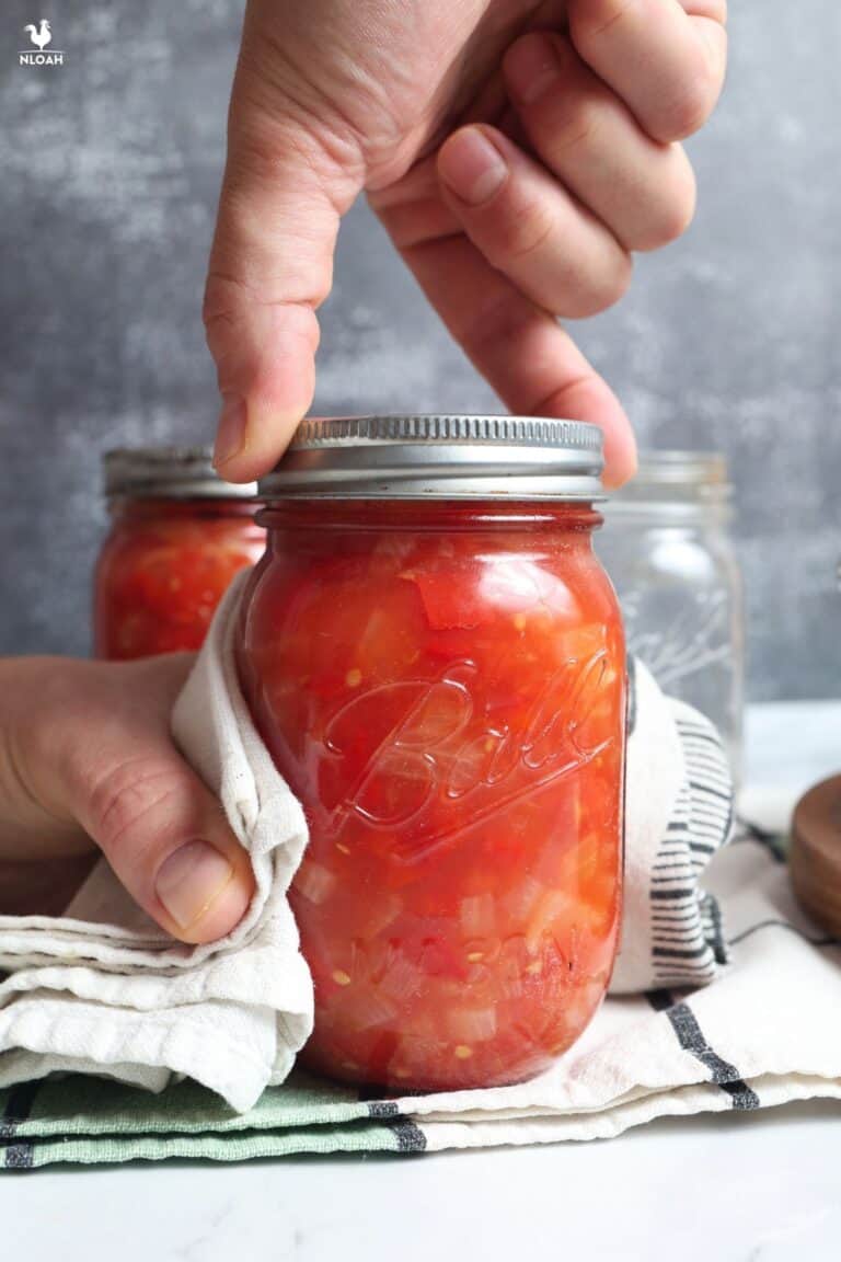 placing band on salsa jar