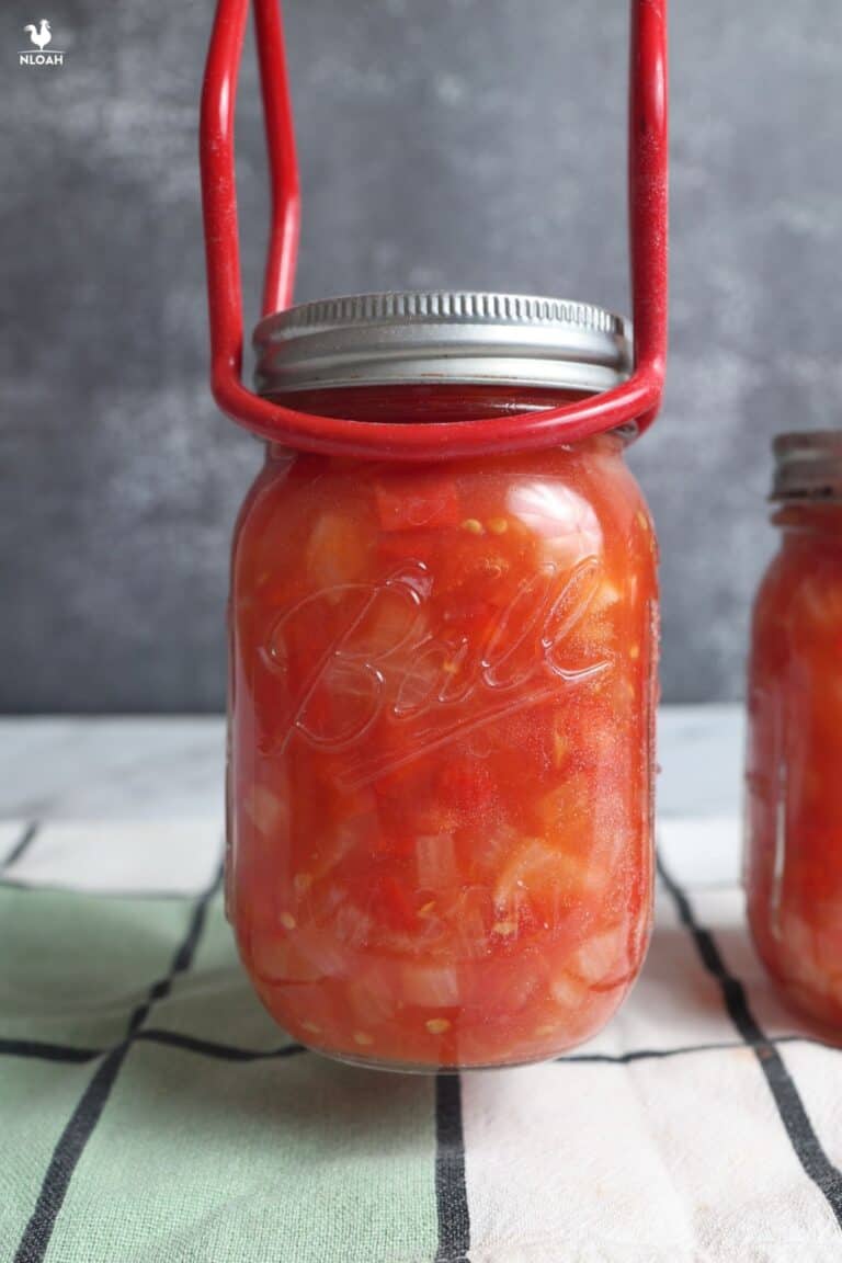 setting canned salsa jar to cool